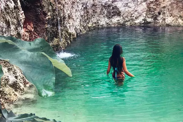 Girl enjoying cenotes in Tulum