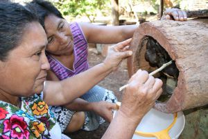 Mayan ladies taking care of melipona bees