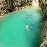 Tourist swiming in Koleeb cab cenote