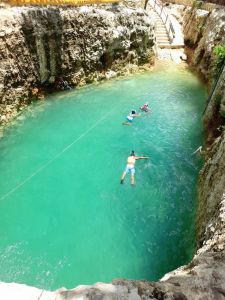 Tourist swiming in Koleeb cab cenote